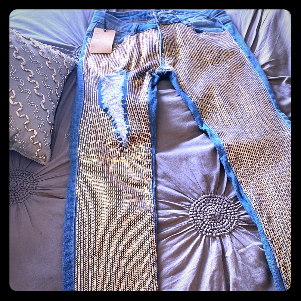 Machine distressed sequin jeans